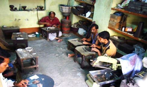 Artisans at work in a filigree warehouse